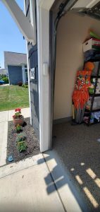 Car backed into garage after