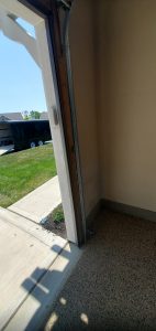 Car backed into garage after